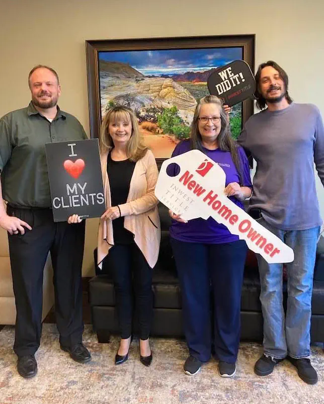 Scott Buehler with their real estate agent Diane Ray and clients Stormee and Brandon
