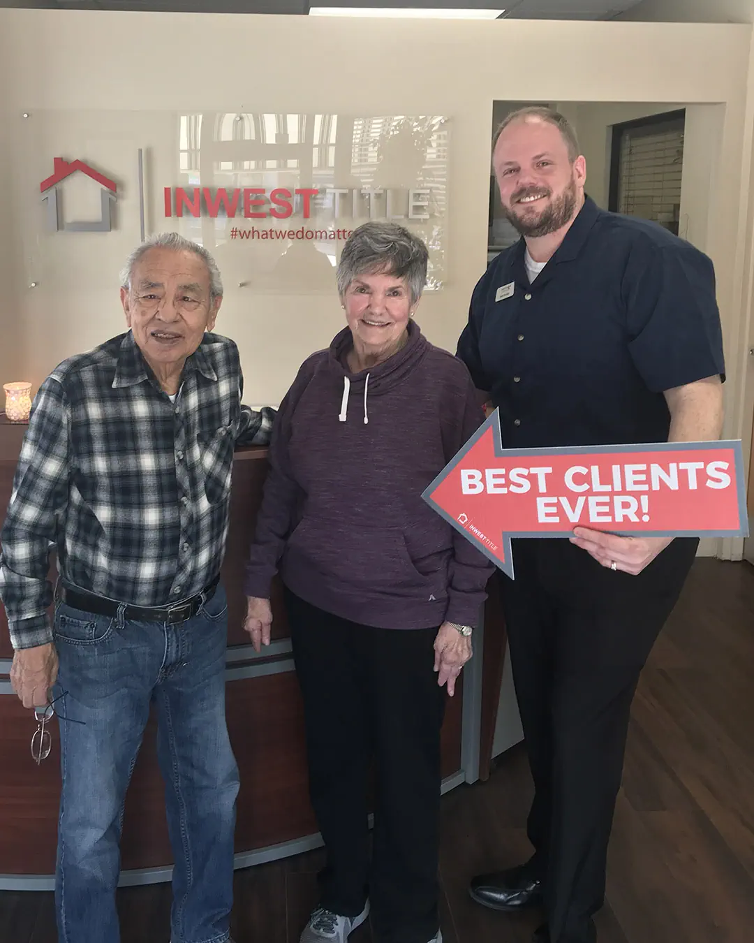 Scott Buehler with Katherine and Pete at the title office after closing on their refinance.
