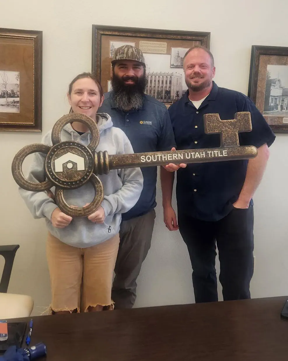 Scott Buehler with Blaine and Nicole after closing on their sale of their townhome and the purchase of their new single family home